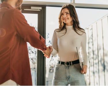 Agent and client shaking hands